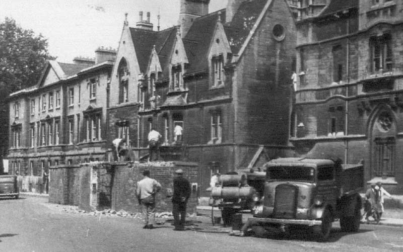Workmen demolishing the air raid shelter outside Balliol College, 13 June 1946
